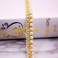 Elegante Filo Perle con ricami dorati